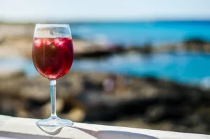 Glass of sangria by a sea bar
