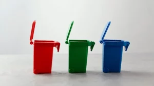 Three miniature recycle bins